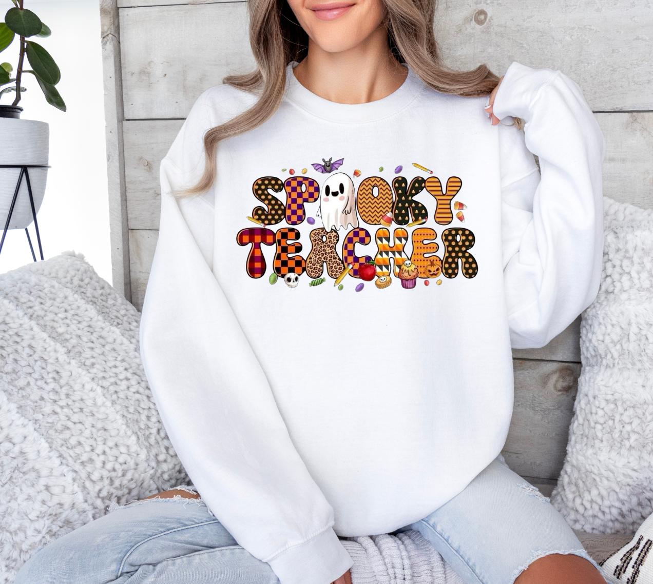 Spooky Teacher shirt with Halloween-themed design, perfect for humorous teachers.