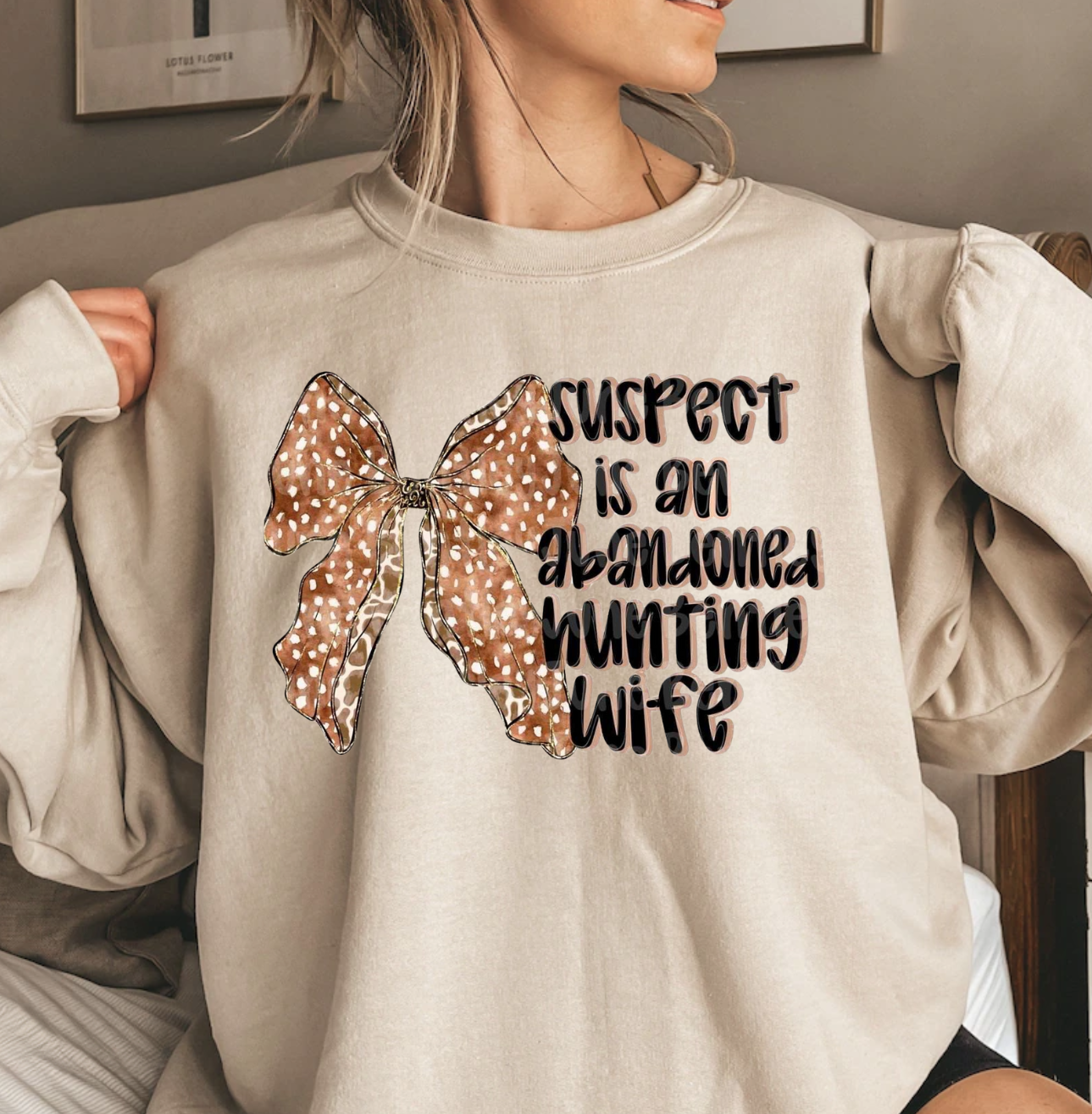 Suspect-Abandoned Hunting Wife novelty shirt with humorous design.