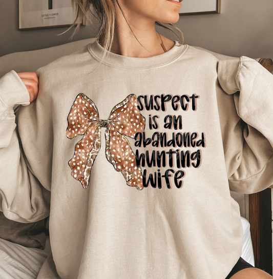 Suspect-Abandoned Hunting Wife novelty shirt with humorous design.