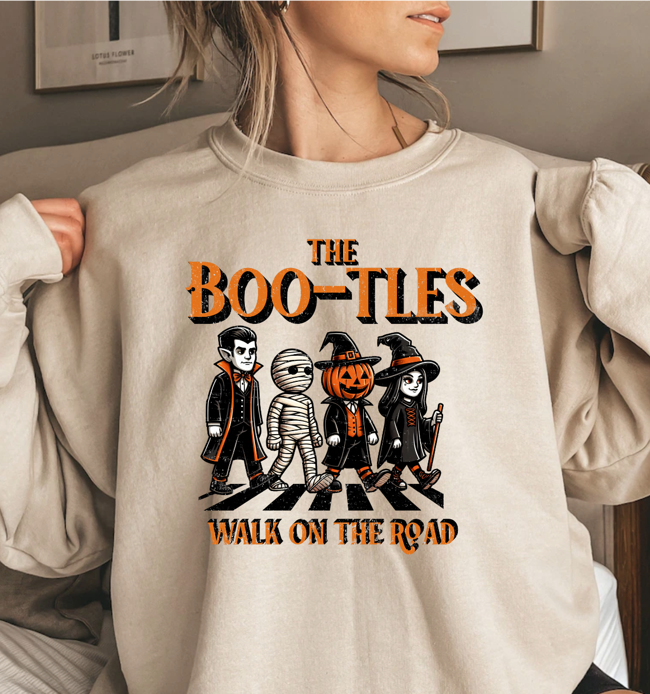 The Boo-Tles Walk The Road Halloween album cover sweatshirt featuring spooky characters.