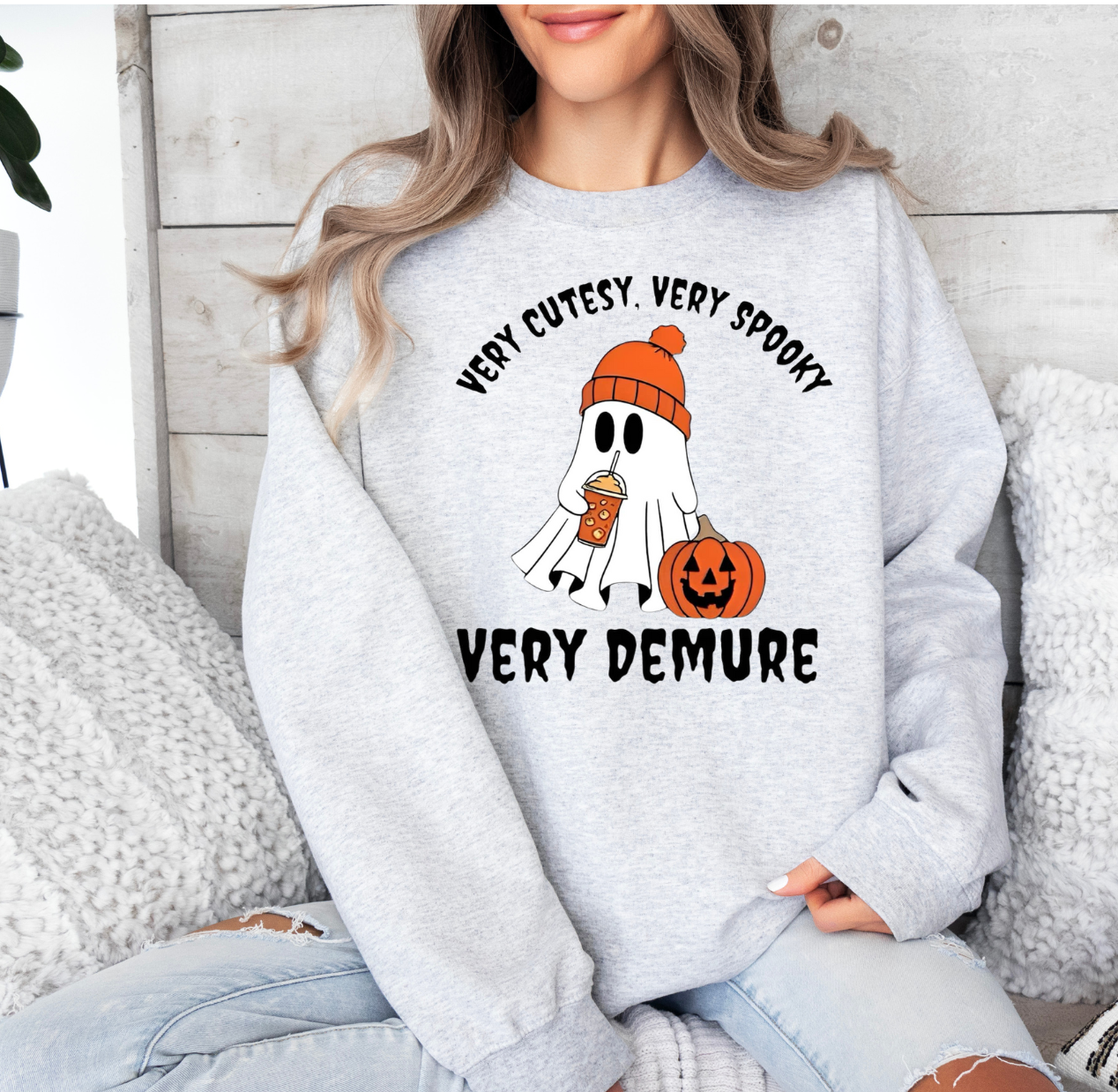 Very Cutesy spooky Halloween shirt featuring a cute ghost and pumpkin design.