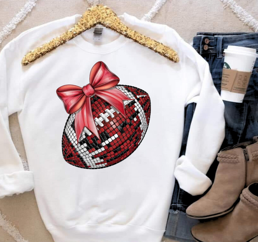 Disco Football shirt with colorful bow design on hanger, surrounded by jeans and boots.