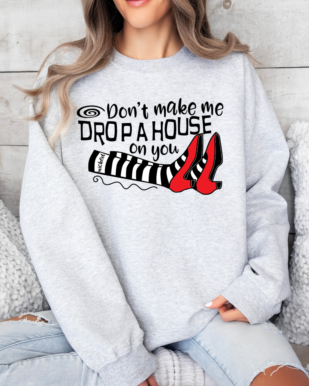 Wizard of Oz inspired "Don't Make Me Drop A House On You" t-shirt with witchy vibes.