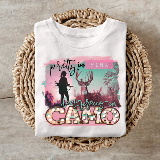 Pretty in Pink Dangerous in Camo shirt with edgy design featuring a silhouette and camo elements.