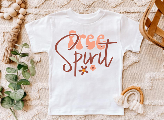 Free Spirit infant and toddler shirt with floral design on white fabric.