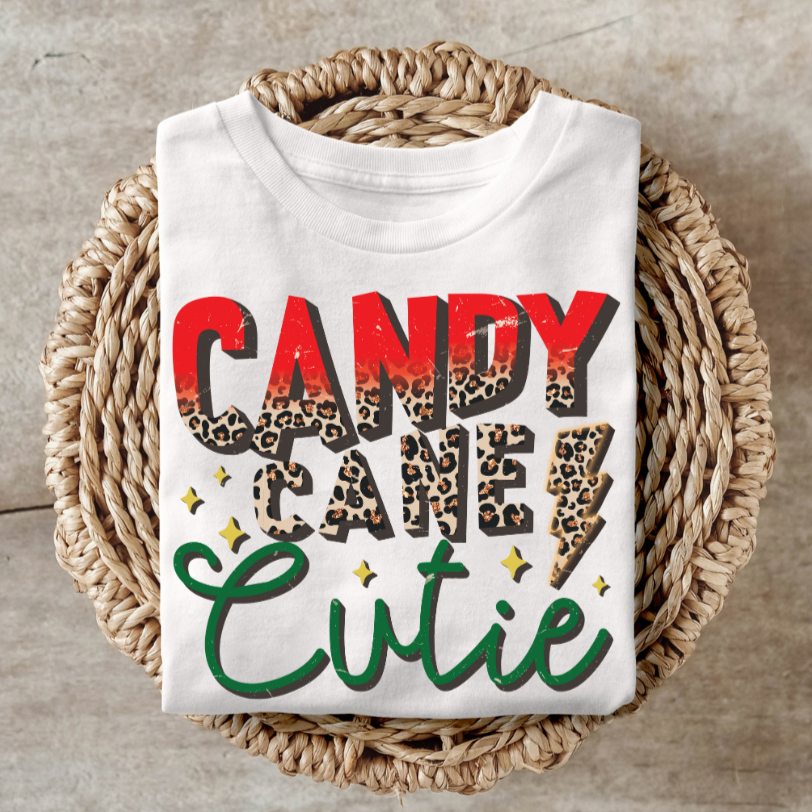 Candy Cane Cutie shirt with festive design on woven basket.