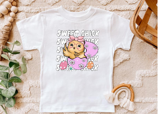 Sweet Chick Easter shirt with vibrant chick design and logo.
