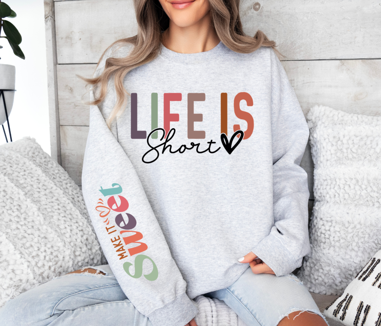 Sweatshirt with "Life Is Short Make It Sweet" design in colorful text.