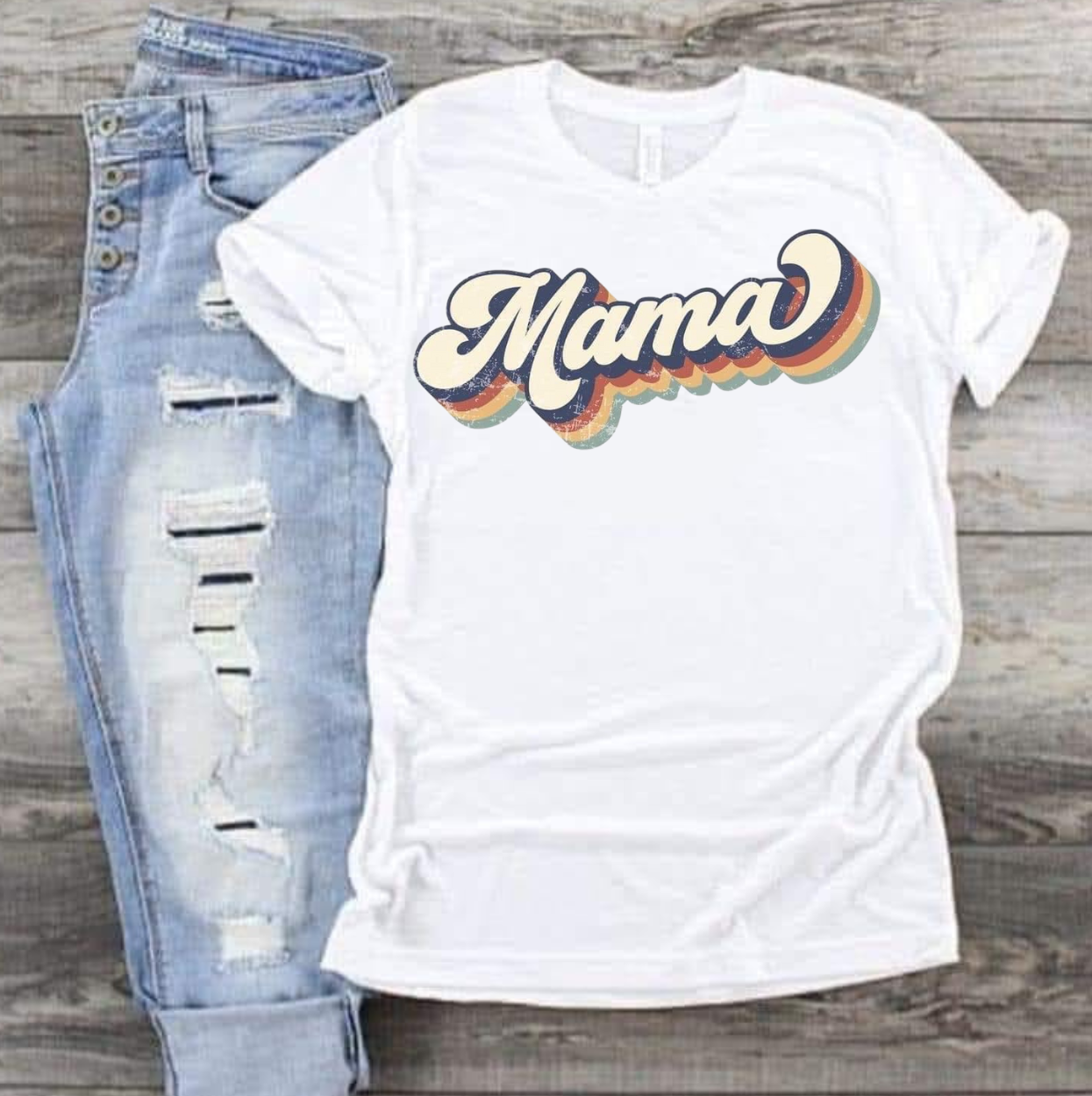Mama-Retro Shirt with vintage flair on white fabric, paired with distressed jeans.