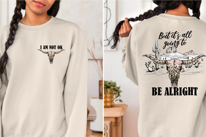 Shirt with "I Am Not Ok" text on front and "But It's All Going to Be Alright" on back with desert scene.